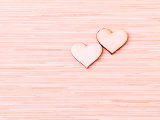 The wooden hearts on wooden background. - Concept for love and w