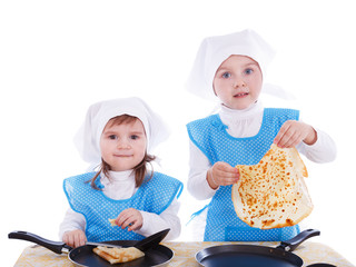 Little children with pancakes playing as chefs