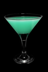 Cocktail in glass on black background isolated.