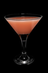 Cocktail in glass on black background isolated.