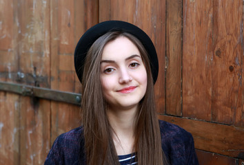 Close-up portrait of beautiful girl on vintage background