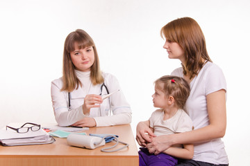 Fototapeta premium Pediatrician offers to put a thermometer child on lap
