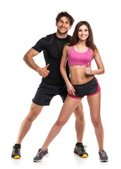 Athletic couple - man and woman with thumb up on the white