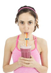 Woman drinking delicious strawberry smoothie