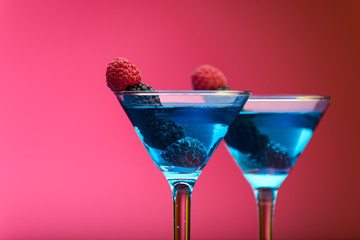 Colorful cocktails garnished with berries