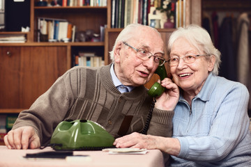 Senior couple at the telephone