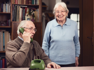 Senior couple at the telephone