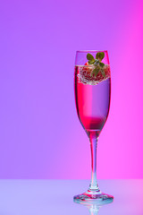 Champagne glass with strawberry, studio shot with light effects