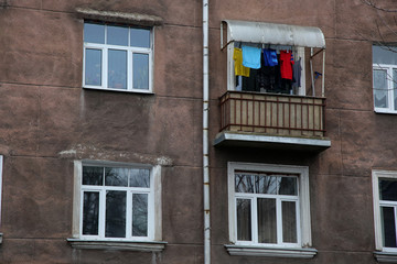Four window of dark house with balcony