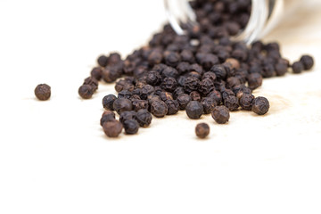 closeup dried black pepper on white background