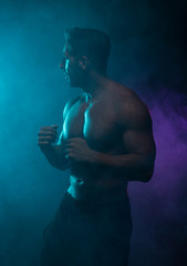 Fototapeta na wymiar Silhouette Topless Athletic Man in a Fighting Pose