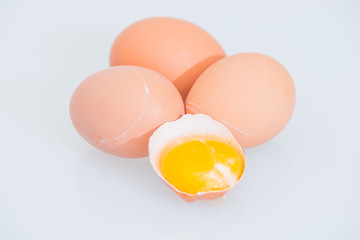 fresh egg and broken eggs isolated on white background