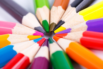 Fototapeta premium Colorful wooden pencils in the circle isolated on white