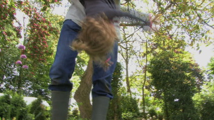 MS OF A FATHER HANGING HIS DAUGHTER UPSIDE DOWN