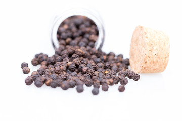 closeup dried black pepper on white background