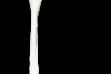 milk on a black background