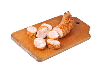 sliced sausage on cutting board isolated on white background