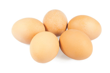 Five chicken eggs on a white background