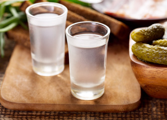 glasses of vodka with various snack