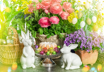 Easter cake, spring flowers, eggs and bunny. Light leaks