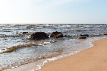 Fototapeta premium Shoreline of Baltic sea beach with rocks and sand dunes
