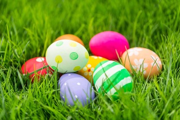 Colorful Easter eggs decorated in the grass