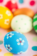 Easter decorations - eggs with painted flowers on the tabletop