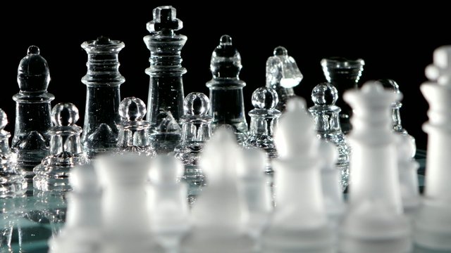Party game of chess. Black background.