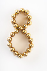 Numbers made of 9 mm cartridges on white background