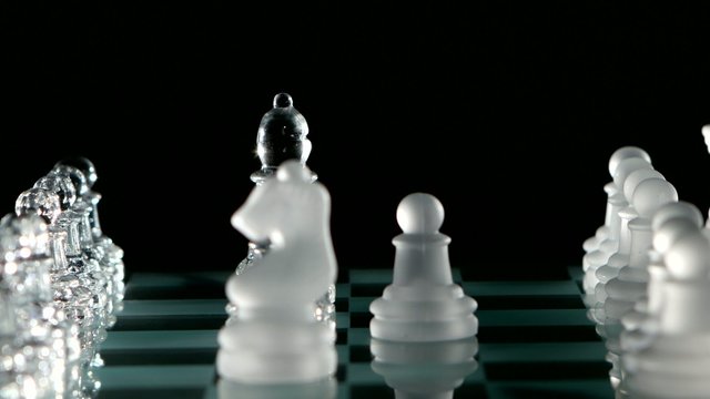 Knight's move in chess on black background