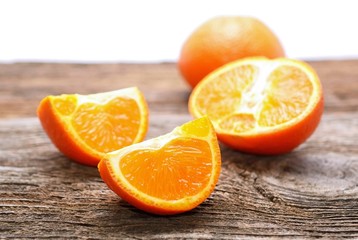 Tangerine slices on wooden table