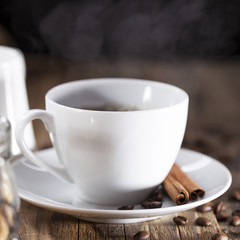 Delicious coffee with sweets on a wooden table
