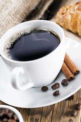 Delicious coffee with sweets on a wooden table