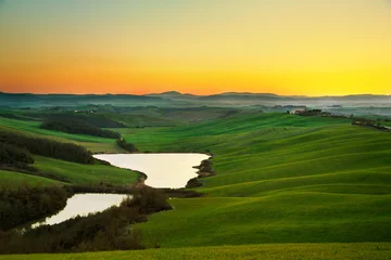 Zelfklevend Fotobehang Tuscany, rural landscape on sunset, Italy. Lake and green fields © stevanzz