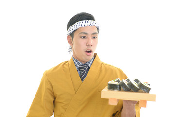 驚いた表情の寿司職人