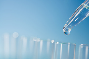 Scientific background with laboratory glassware, text space