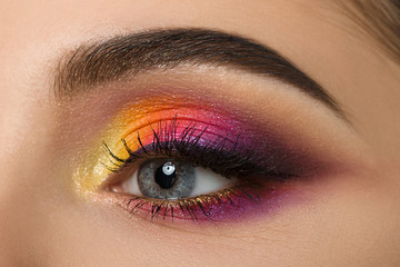 Fototapeta premium Close-up of woman eye with beautiful colourful makeup