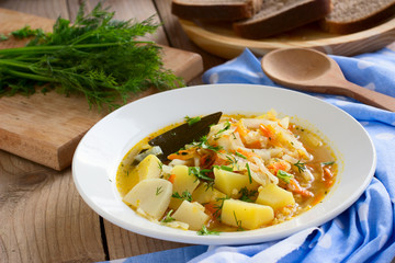 Traditional Russian cabbage soup with proso millet and potato