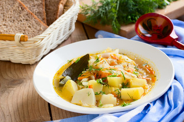 Traditional Russian cabbage soup with proso millet and potato