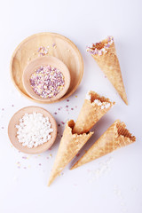 empty ice cream cones with colorful sprinkles