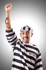 Naklejka premium Convict criminal in striped uniform