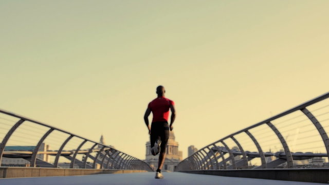 Male starting positions on millenium bridge London, UK and sprint over bridge