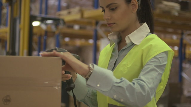 Woman working in logistic warehouse