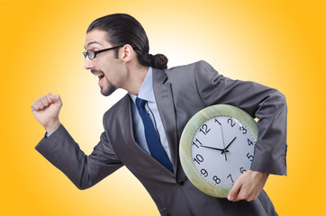 Man with clock isolated on white