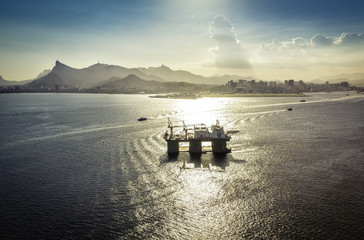 Oil drilling rig against panorama of Rio De Janeiro, Brazil