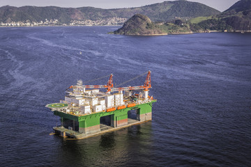 Oil drilling rig against panorama of Rio De Janeiro, Brazil