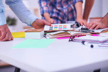 Fototapeta premium Young business people working at office on new project