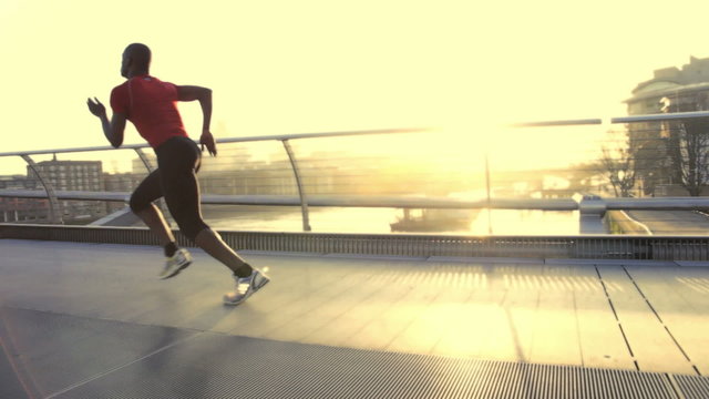 Male starting positions on millenium bridge London, UK and sprint over bridge