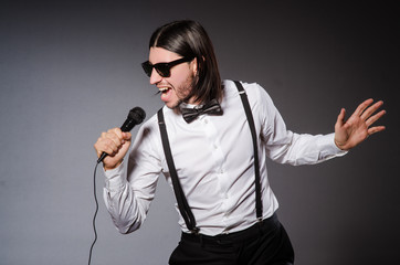 Funny singer with microphone at the concert