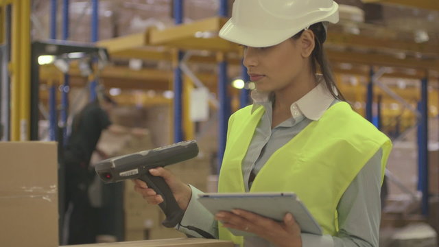 Woman working in logistic warehouse